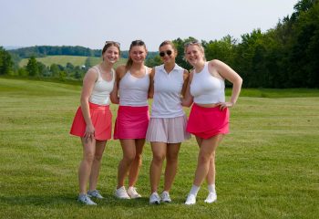 Four women golfers smiling on the fairway during Women’s Golf Day at Ironwood Golf Course in Western New York