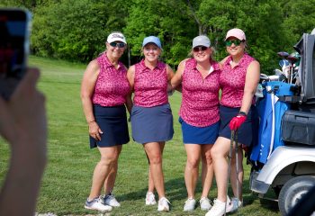 Four women golfers posing together on the course during Women’s Golf Day at Ironwood Golf Course in Western New York