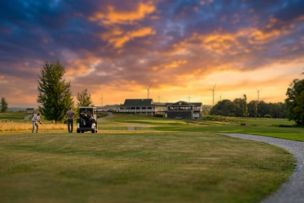 Golfers playing near clubhouse at Ironwood Golf Course in Western New York