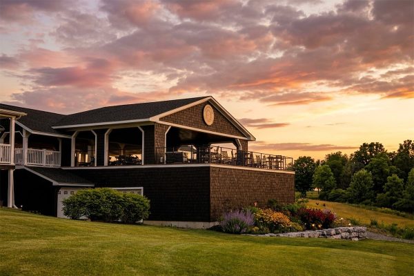Clubhouse and outdoor patio at Ironwood Golf Course during sunset in Western New York