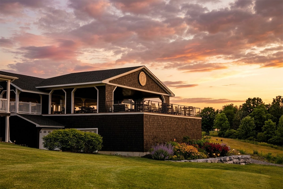 Clubhouse and outdoor patio at Ironwood Golf Course during sunset in Western New York